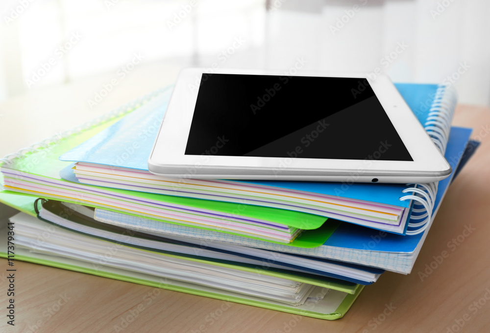 School notebooks and tablet, closeup School notebooks and tablet, closeup
