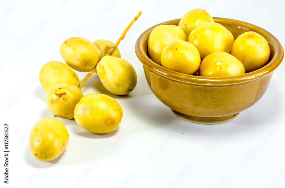 Group of fresh date palm fruits on white background Group of fresh date palm fruits on white background