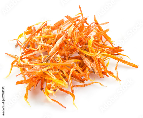 Dry marigold or calendula florets on a white background.