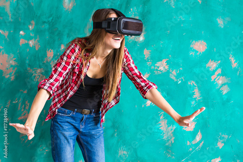 Young Woman feeling shocking for using the virtual reality device © satura_