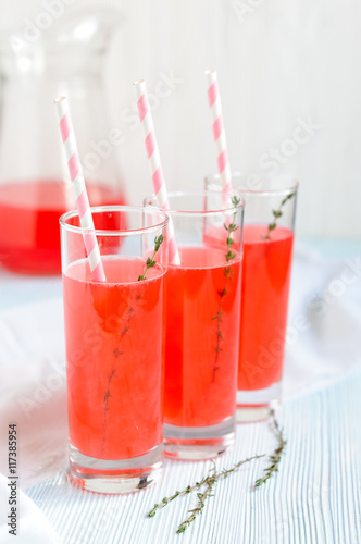 Pink fruit lemonade in tall glasses