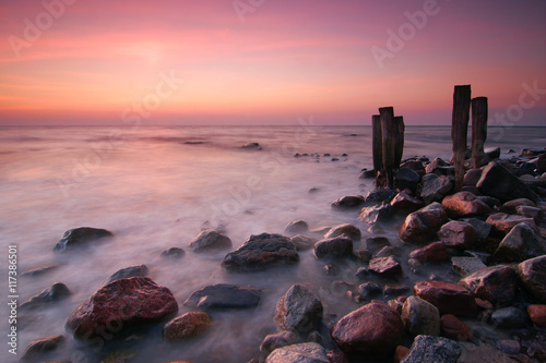 Coastal Sunrise, Beach with Huge Boulders and Wooden Posts, Kap Arcona, Rugen Island, Germany