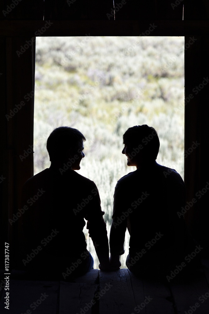 Silhouette of Boyfriend & Girfriend in Barn Window