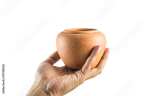 Men's hand holding Earthenware Jur isolate on a white background photo