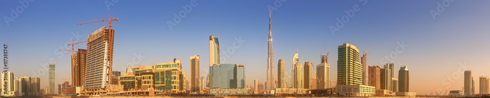 Panoramic view of Business bay and downtown area of Dubai, reflection in a river, UAE