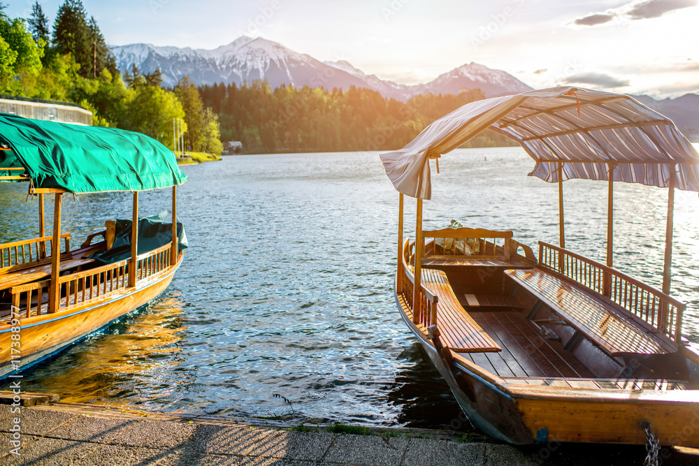 Boats on the Bled lake in the morning in Slovenia.