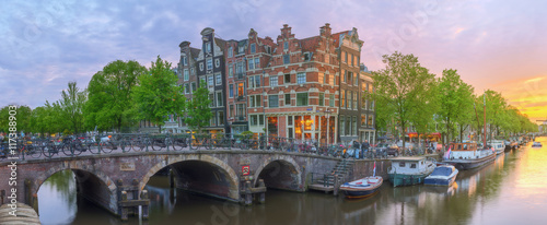 Amstel river, canals and night view of beautiful Amsterdam city. Netherlands