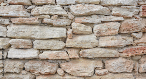 Wall from light-beige stones