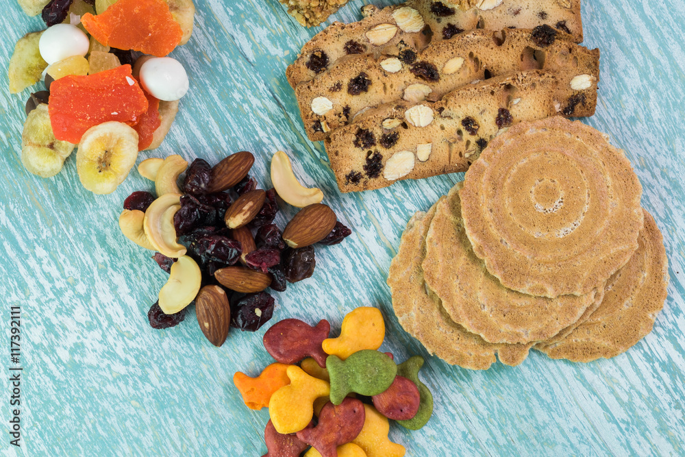 Variety of snacks. Sweet tropical nut trail mix, granola bars, goldfish crackers, almond biscuits. Variety of snacks. Sweet tropical nut trail mix, granola bars, goldfish crackers, almond biscuits.