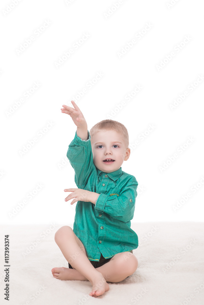 cute little boy raised his hand up, isolated on white background cute little boy raised his hand up, isolated on white background
