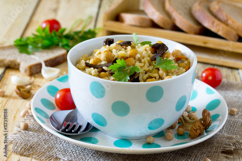 Vegetarian vegetable pilaf with chickpeas and wild mushrooms on