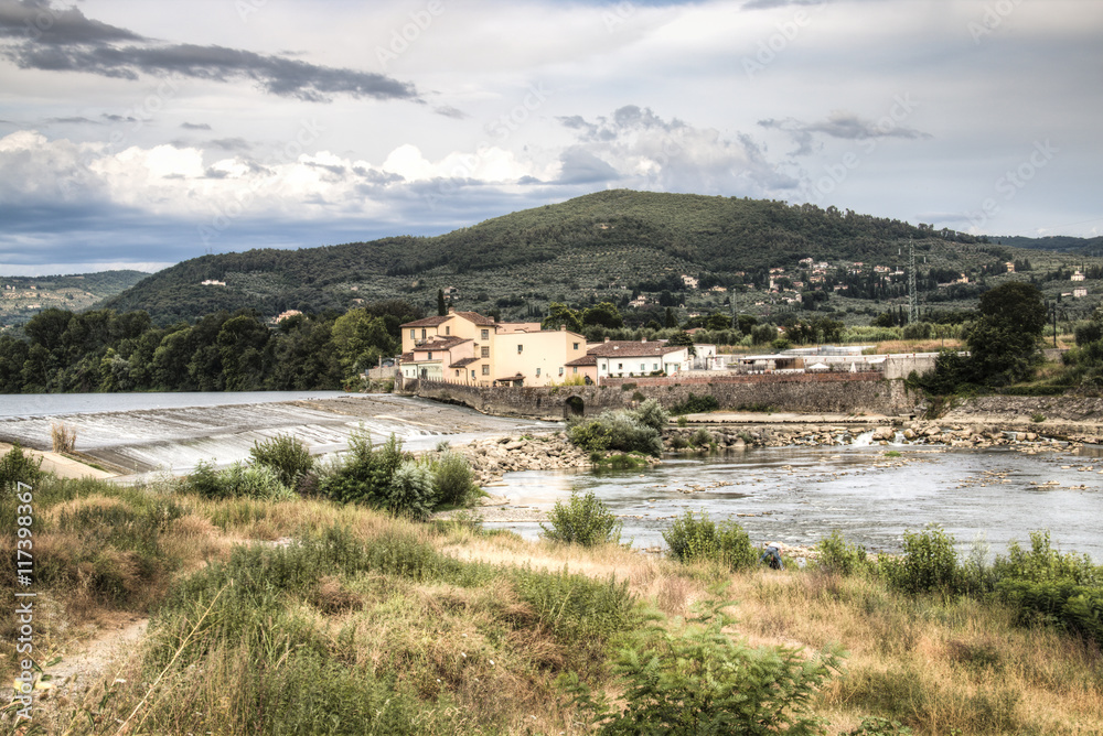 Tuscan landscape with the Arno river near the city of Florence, Italy
