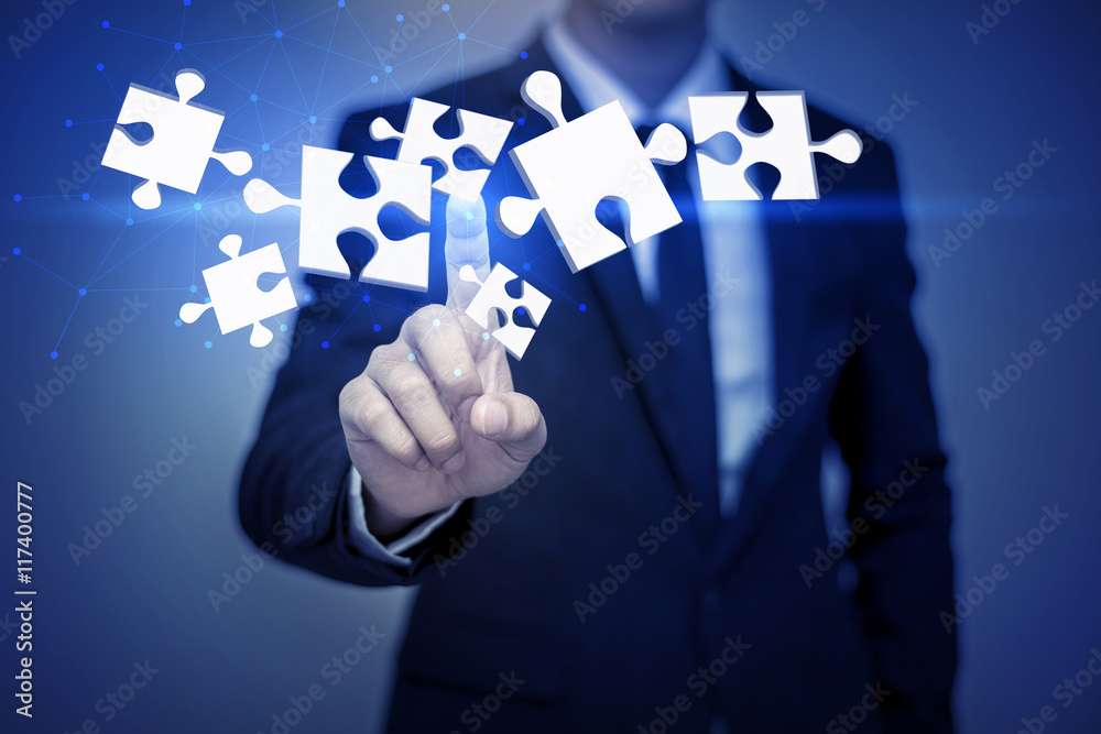 businessman touching 3D puzzle , business concept businessman touching 3D puzzle , business concept