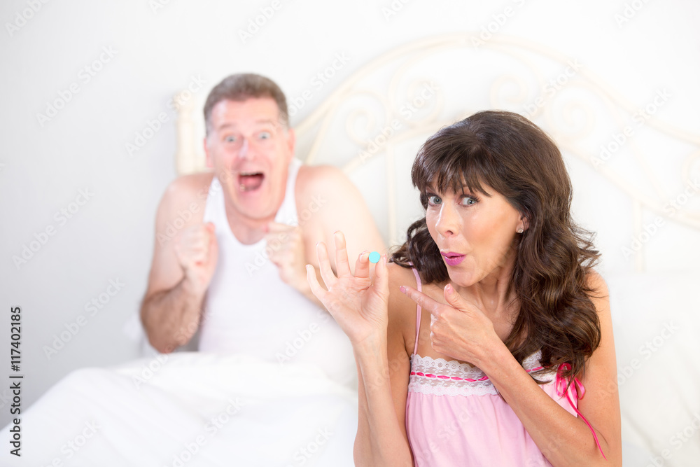Woman Points to Blue Pill for Erectile Dysfunction for Enthusias Woman Points to Blue Pill for Erectile Dysfunction for Enthusias