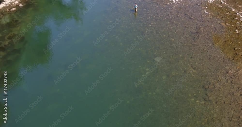 Aerial view of flyfisherman in river, France Aerial view of flyfisherman in river, France