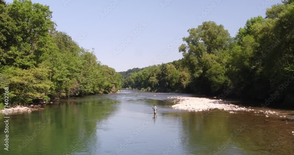 Aerial view of flyfisherman in river, France Aerial view of flyfisherman in river, France