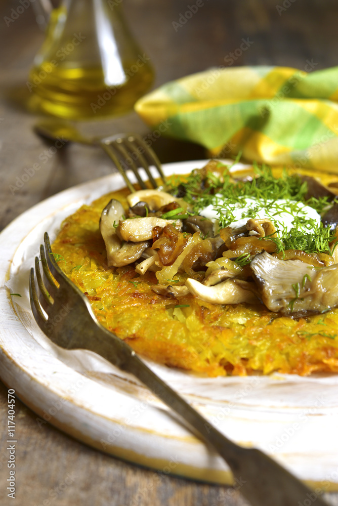 Fried potato pancake with mushrooms and onion. Fried potato pancake with mushrooms and onion.