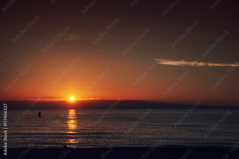 Fototapeta premium The sea and beach at sunset