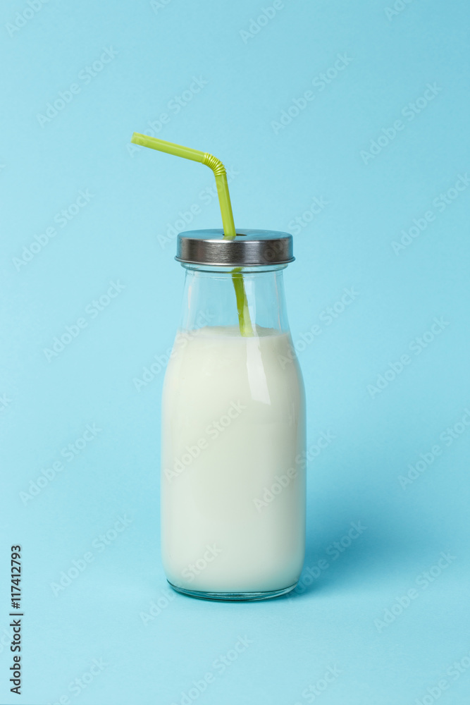 Fresh bottle of milk over blue background Fresh bottle of milk over blue background