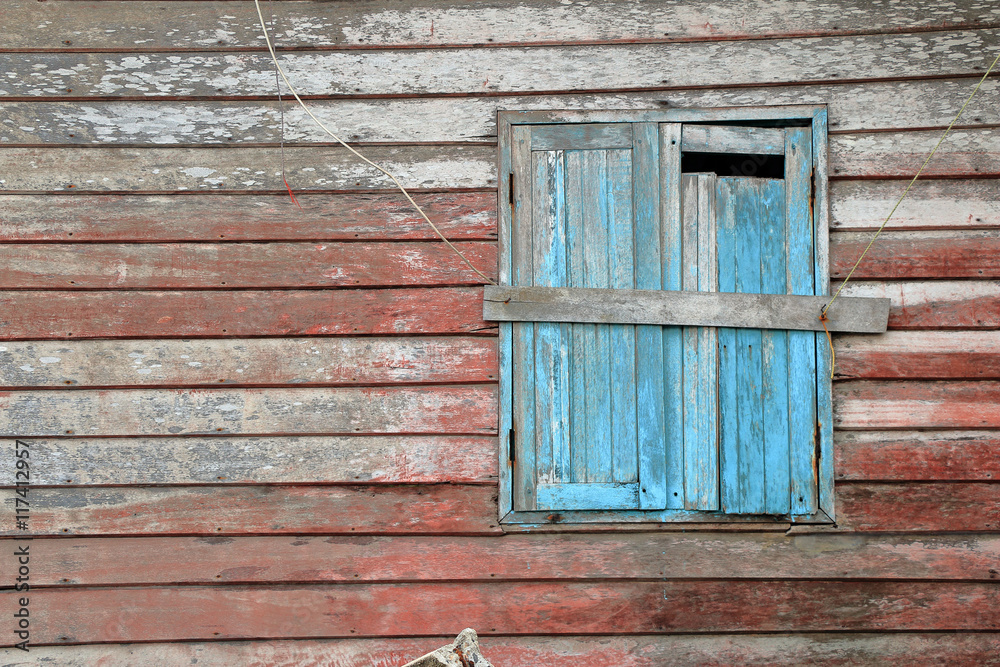 Old blue window of old wooden house wall Old blue window of old wooden house wall