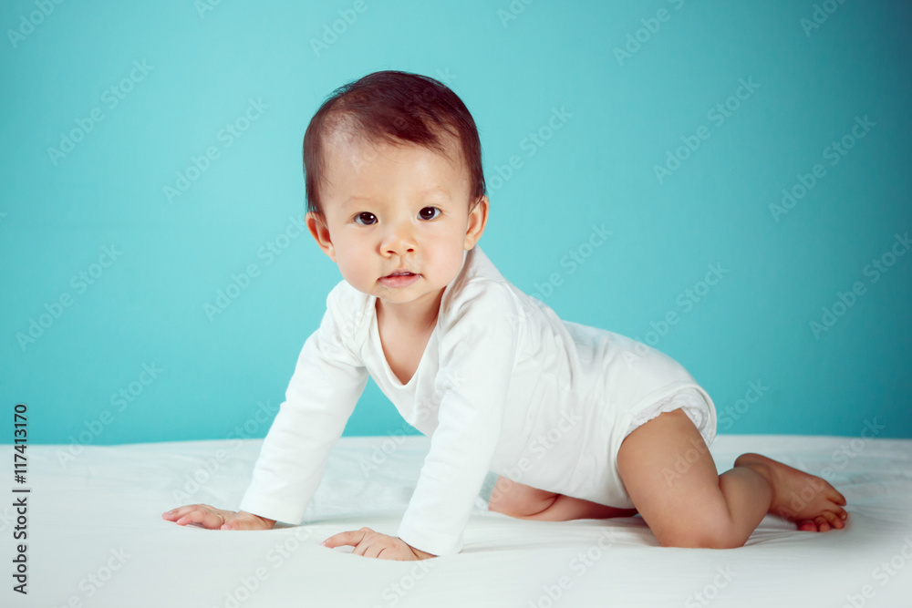 Side view of pretty crawling newborn (soft focus on the eyes) Side view of pretty crawling newborn (soft focus on the eyes)