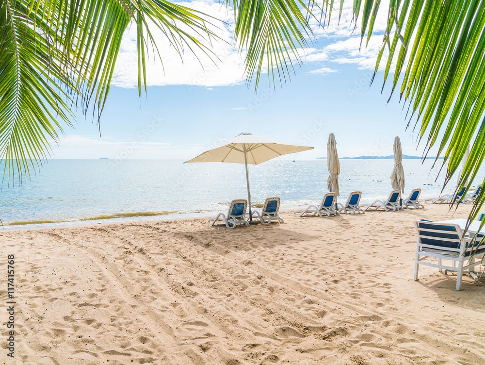 Fototapeta premium Outdoor with umbrella and chair on beautiful tropical beach and
