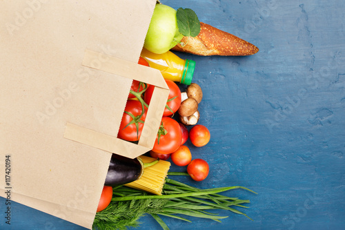 Fototapeta Naklejka Na Ścianę i Meble -  Paper bag with different of vegetables and fruits