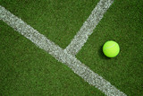 tennis ball near the line on tennis grass court good for backgro