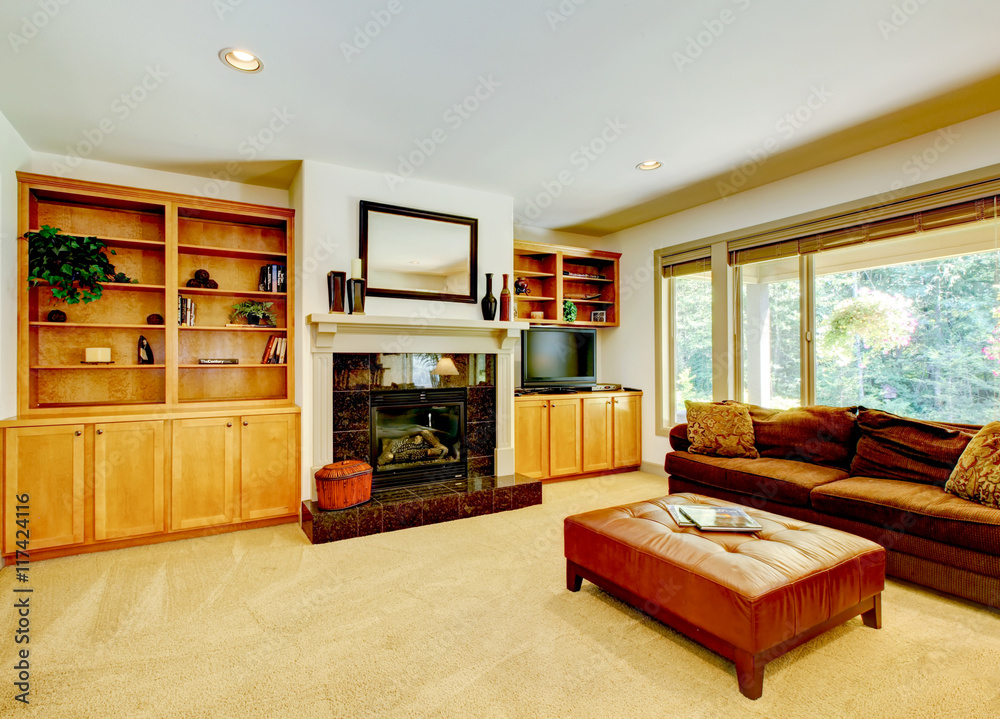 Fototapeta premium Cozy living room with fireplace and sofa. Also carpet floor.