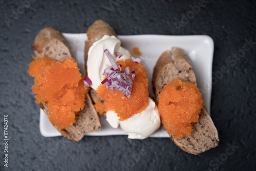 Plate with Swedish caviar on freshly baked bread