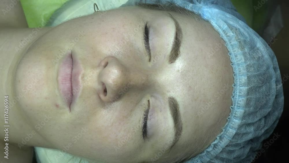 Microblading procedure. Master works with a customer's eyebrows. Semi-permanent make-up. Microblading procedure. Master works with a customer's eyebrows. Semi-permanent make-up.