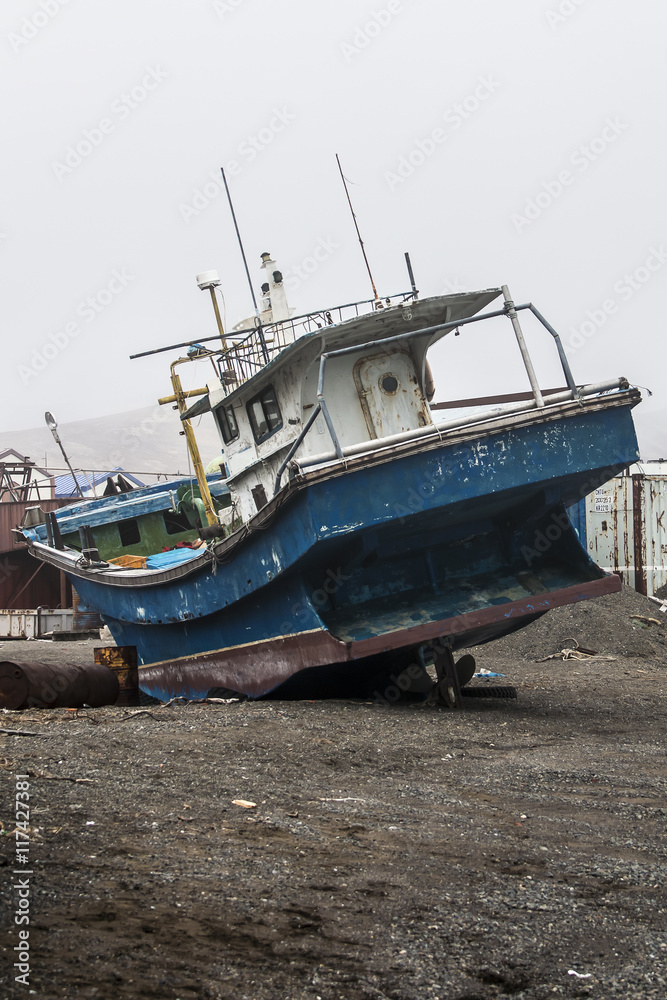 old fishing boat on the shore