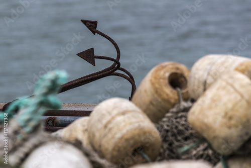 net with anchor stacked on the pier