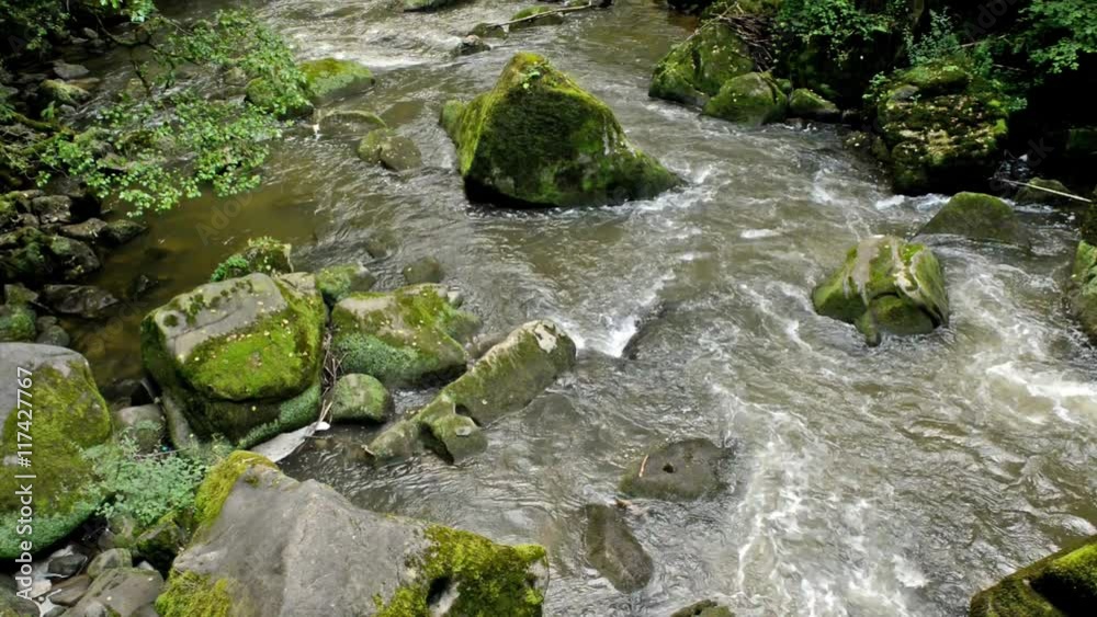 Aerial of a wild river with weathered stones Aerial of a wild river with weathered stones