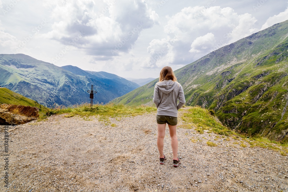 Young woman standing with on edge Young woman standing with on edge