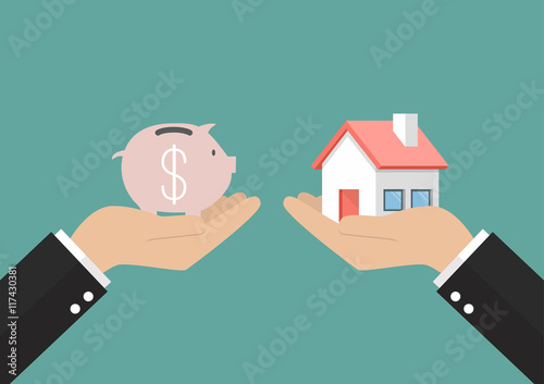 Hands with house and piggy bank