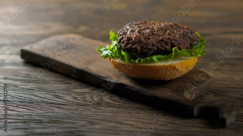Close up view of assembling a beef hamburger