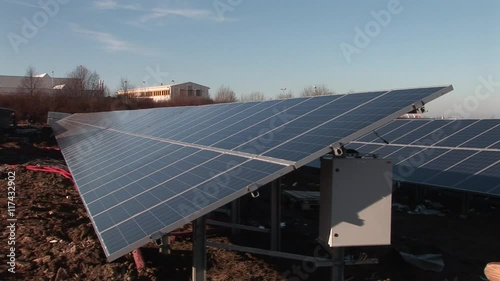 Solar panels with professionals in the background photo