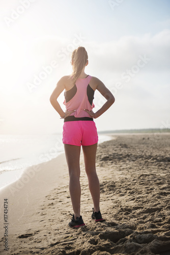 Attractive woman preparing for the jogging.