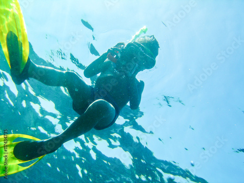 a boy diving with scuba and flipper photo