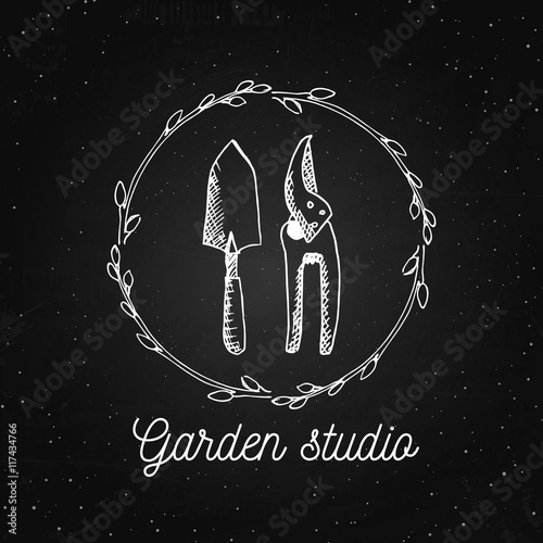 Vector garden logo design template. Garden studio - vintage illustration with hand drawn elements on the chalkboard.