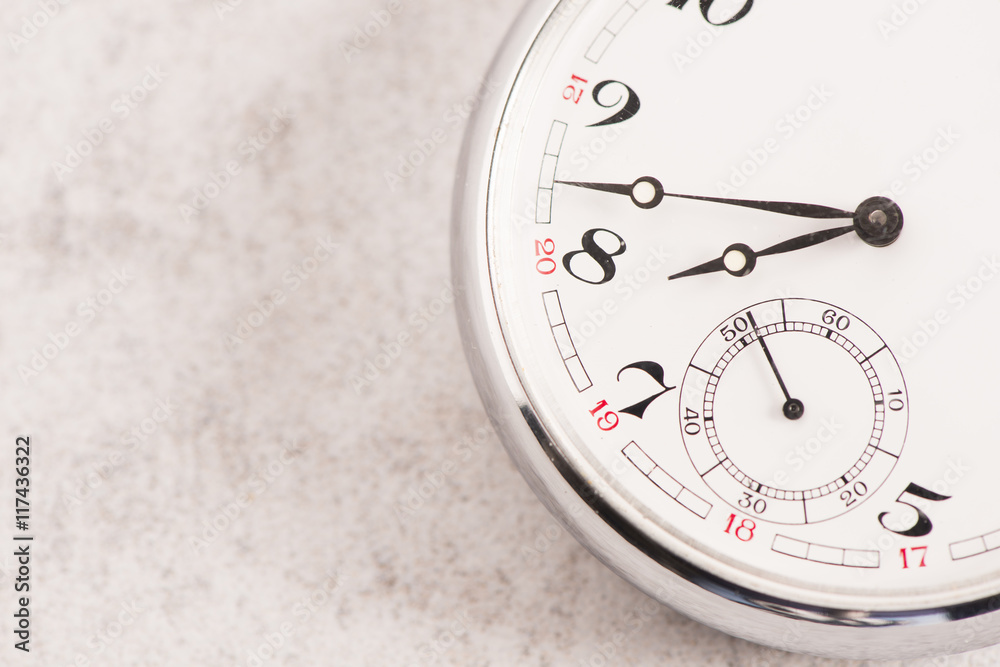 Naklejka premium Old pocket watch detail. Symbol of time, deadline and nostalgia.