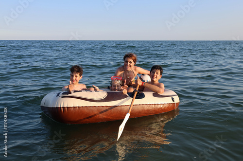 children with young mom on the dinghy © ChiccoDodiFC
