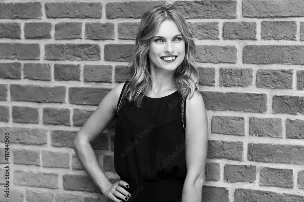 Black and white portrait of smiling young attractive blond woman Black and white portrait of smiling young attractive blond woman