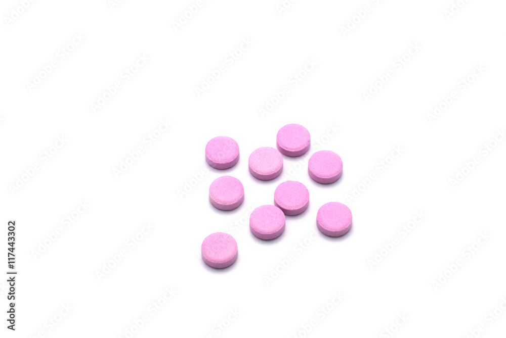 Group of pink pills isolated on white background. Group of pink pills isolated on white background.
