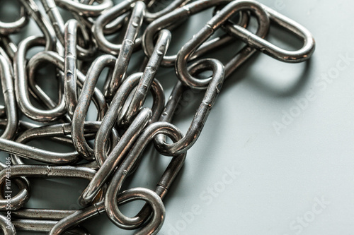 close up of metal chain part on white background