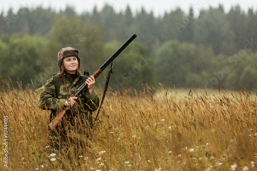woman hunter, autumn rain, forest