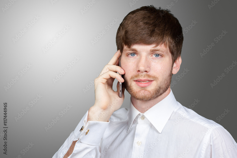 Portrait of a businessman talking on the phone Portrait of a businessman talking on the phone