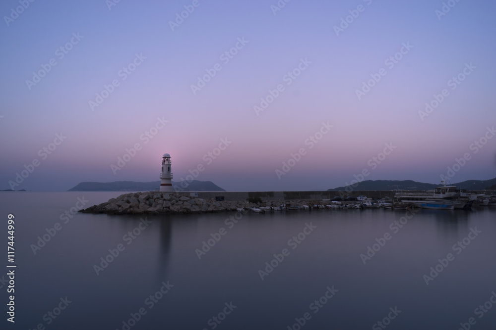 Lighthouse of Kas,, Resort in Turkey.
In the background the Greek Island of Kastelorizo