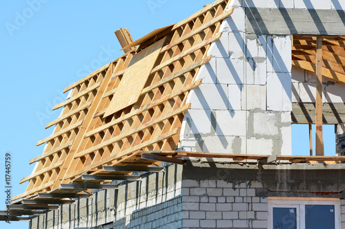 Slika na platnu Attic construction. Reconstruction of the wooden roof.